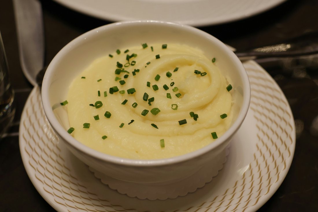 Creamy mashed potatoes topped with chives