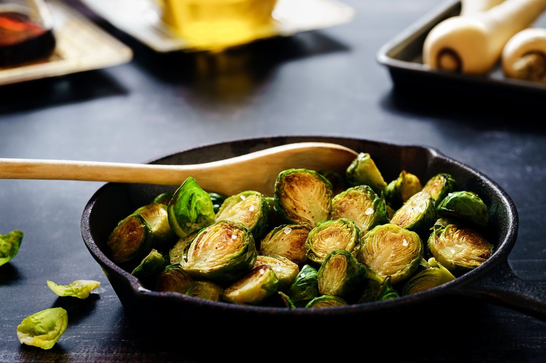 Caramelized brussels sprouts in a cast-iron pan